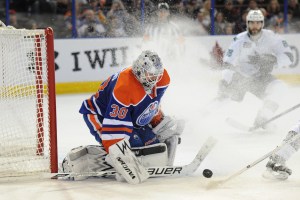 Jan 29, 2014; Edmonton, Alberta, CAN; Edmonton Oilers goalie Ben Scrivens (30) stops a shot during the third period against the San Jose Sharks at Rexall Place. The Oilers won 3-0. Mandatory Credit: Candice Ward-USA TODAY Sports ORG XMIT: USATSI-138256 ORIG FILE ID:  20140129_lbm_wb4_281.JPG